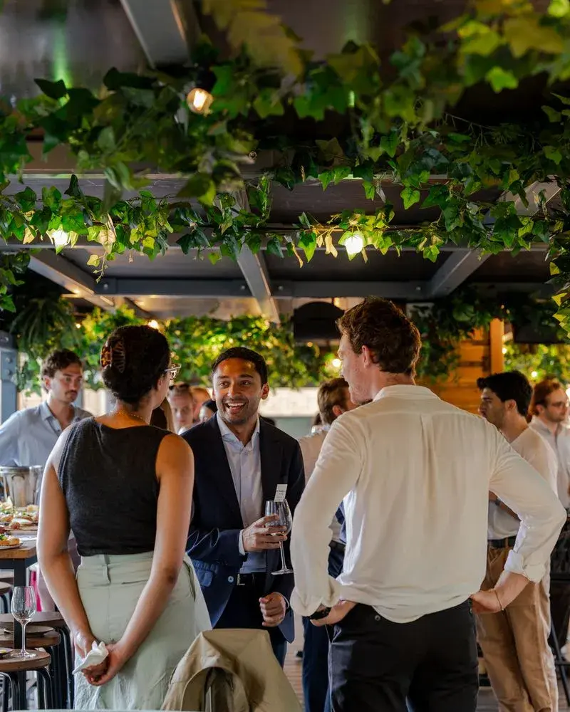 Attendees networking Green Project's happy hour event during London Climate Action Week